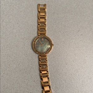 Rose Gold Fossil watch, with grey pearlized face.